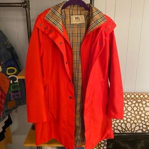 Red Burberry raincoat